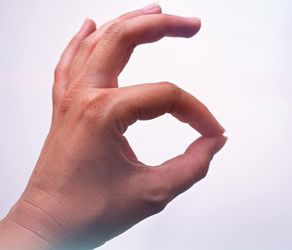 Close-up of hands in a calm gesture.